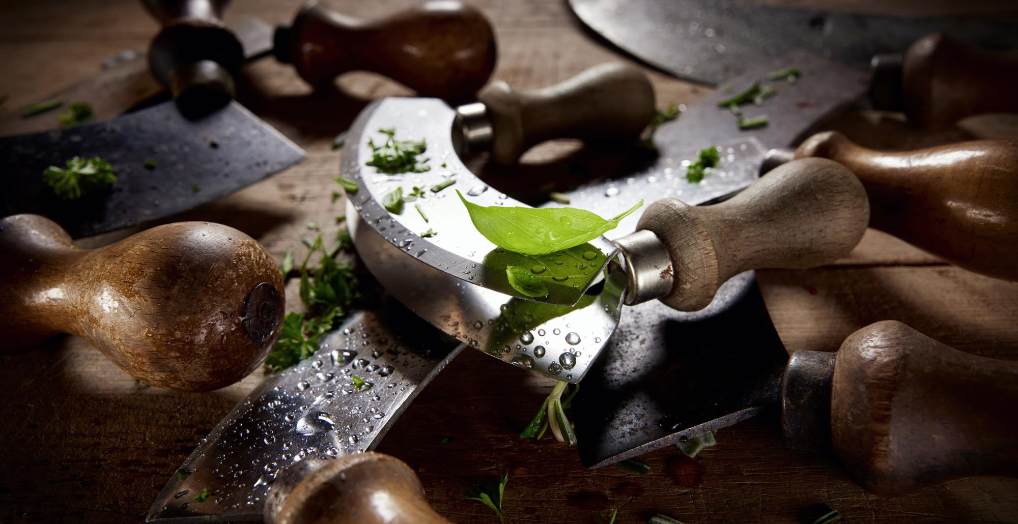 Close-up artisan kitchen counter with herbs and tools